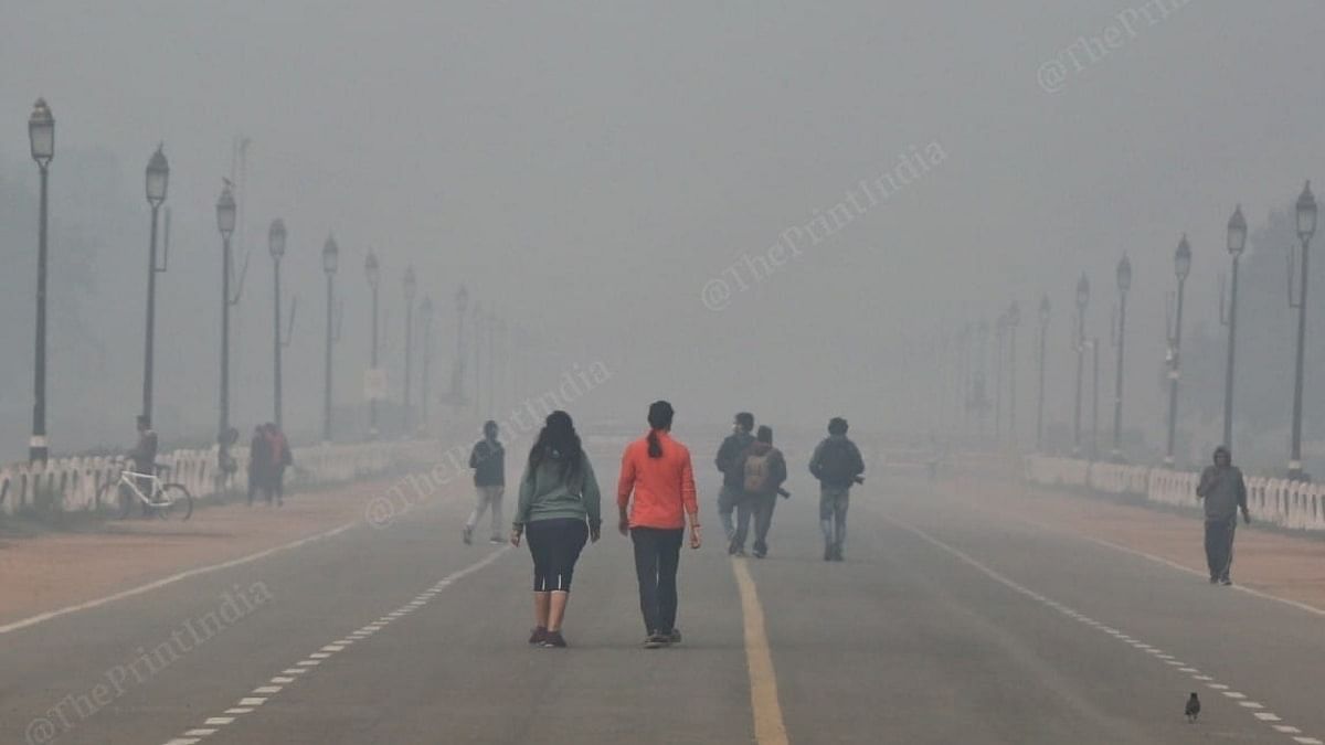 Joggers near India Gate amid rising air pollution in the national capital Sunday | Photo: Suraj Singh Bisht | ThePrint