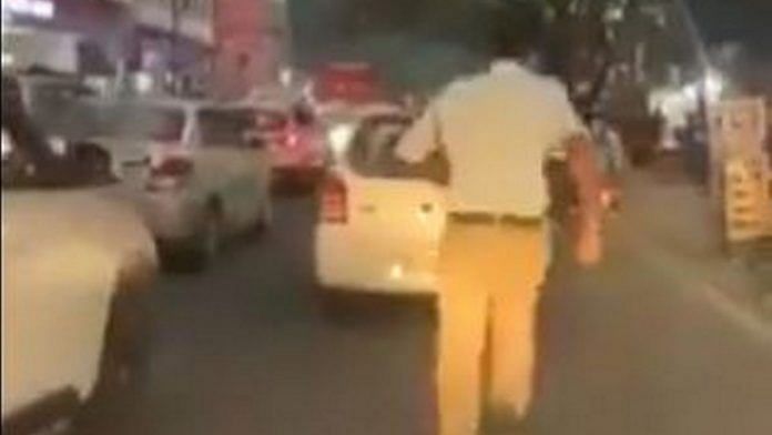 A screen grab of the video showing constable G. Babji clearing way for an ambulance | Twitter | @AddlCPTrHyd
