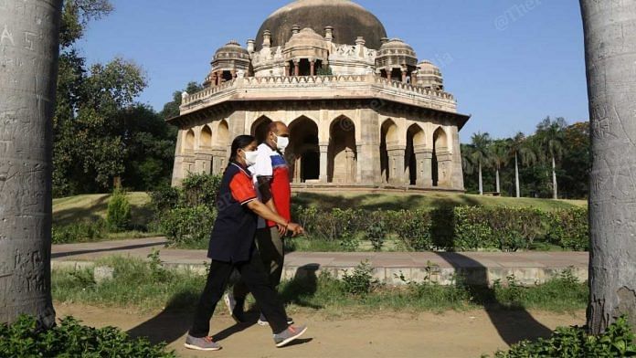 A couple walking in a park in Delhi wearing masks (representational image) | Photo: Manisha Mondal | ThePrint