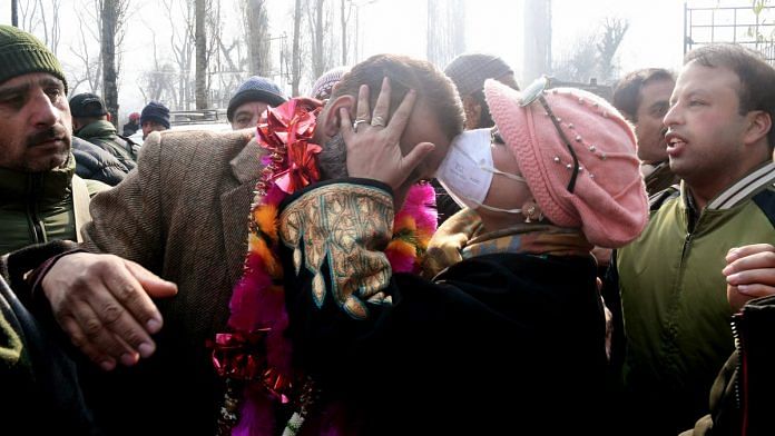 A National Conference candidate who won in the J&K DDC polls celebrates with his supporters in Srinagar Tuesday | Photo: ANI