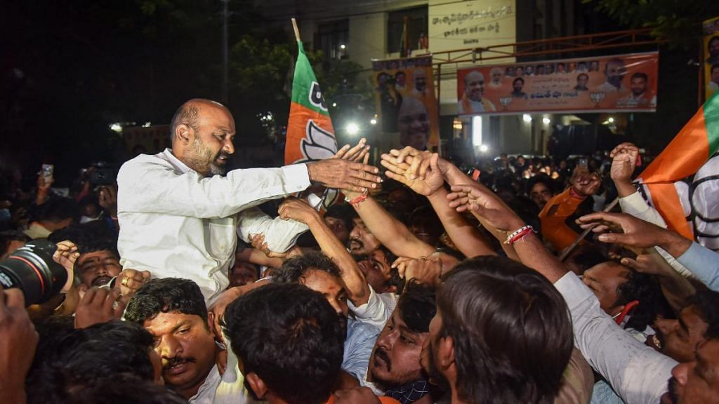 Telangana BJP chief Bandi Sanjay Kumar and party workers celebrate the Greater Hyderabad Municipal Corporation (GHMC) election results in Hyderabad on 4 December 2020 | PTI