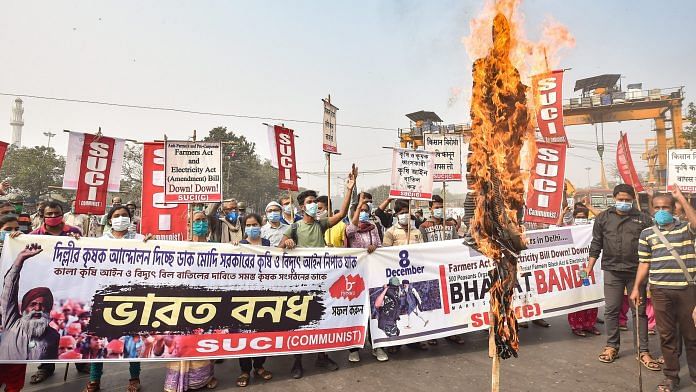 Socialist Unity Centre of India (SUCI) activists participate in a rally in support of the nationwide strike in Kolkata, 8 December 2020 | PTI Photo/Swapan Mahapatra