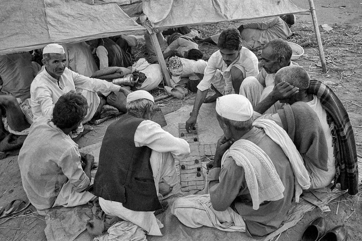Farmers play the game Chaupar while sitting in the laws of Boat Club | Photo: Praveen Jain | ThePrint