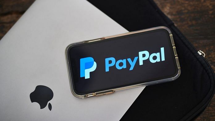 PayPal Holdings Inc. signage is displayed on a phone. (Representational Image) | Photographer: Gabby Jones | Bloomberg