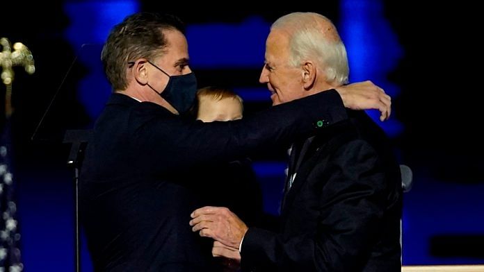 Hunter Biden (left) hugs father and President-elect Joe Biden in November, 2020 | Bloomberg