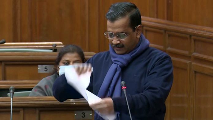 Delhi CM Arvind Kejriwal tears up a copy of three contentious farm laws during a special session of the Delhi Assembly, on 17 December 2020 | ANI