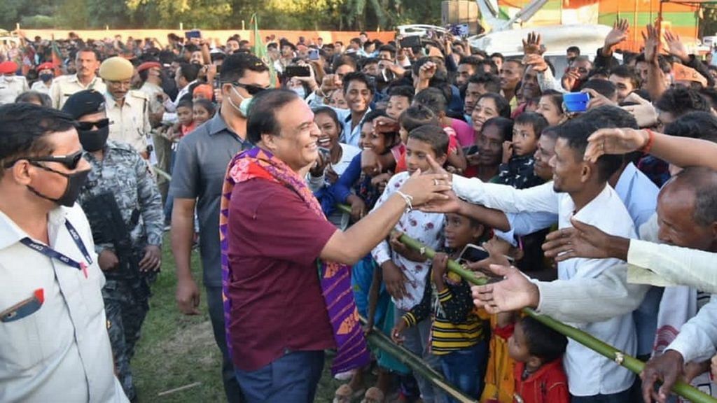 Assam Health Ninister Himanta Biswa Sarma greeting a crowd without wearing a mask | By special arrangement