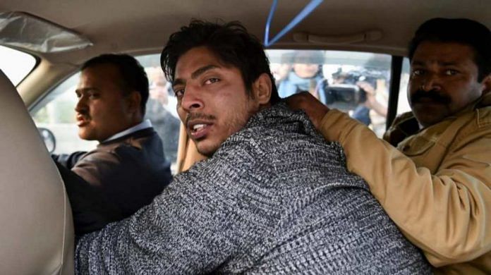File photo of Kapil Gujjar being taken away by police | PTI