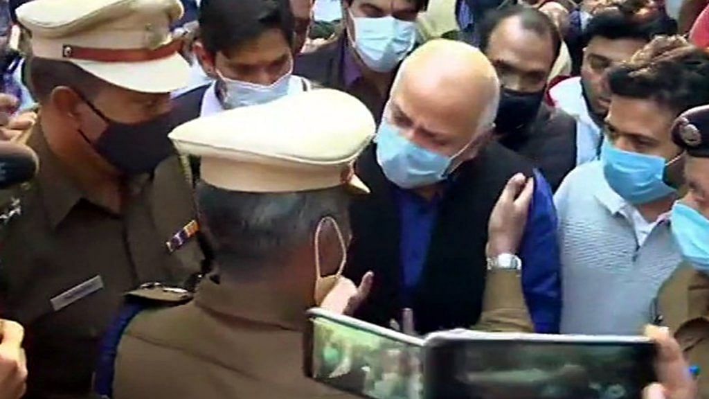 Delhi Deputy CM Manish Sisodia speaks to police officials during a sit-in protest outside Chief Minister's residence, in New Delhi on 8 December 2020 | ANIDelhi Deputy CM Manish Sisodia speaks to police officials during a sit-in protest outside Chief Minister's residence, in New Delhi on 8 December 2020 | ANI