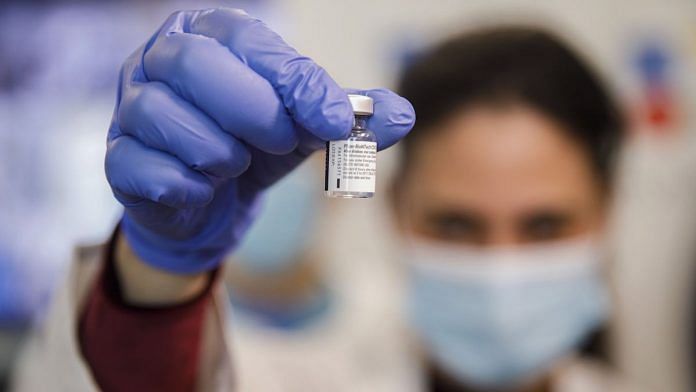 A nurse handles a vial of the the Pfizer-BioNTech Covid-19 vaccine at the Wolfson medical center in Holon | Israel Kobi Wolf/Bloomberg