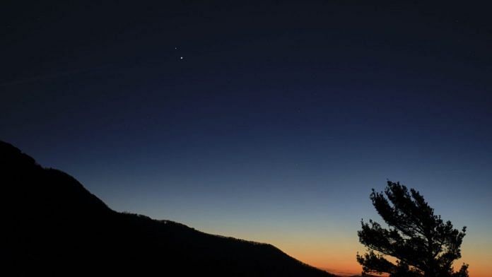 Saturn (top) and Jupiter (below) are seen after sunset at the Shenandoah National Park in the US Sunday | NASA