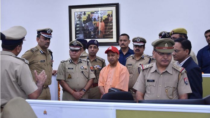 File photo of UP CM Yogi Adityanath being briefed by police officials | uppolice.gov.in