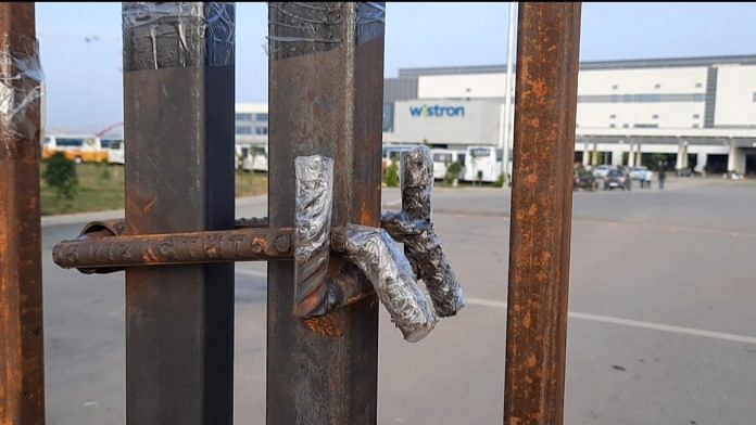 The gates to the Wistron factory in Narasapura, Kolar, are barred with iron rods | Photo: Rohini Swamy | ThePrint