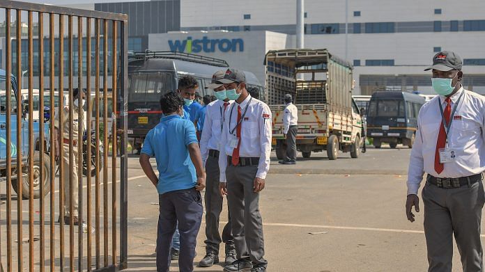 Security personnel stand outside Wistron Manufacturing at Narasapura area in Bengaluru | PTI File Photo