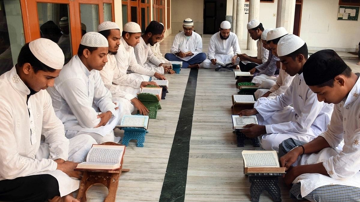 assammadrassa Representational image. | Young students recite text from Holy Quran during the month of Ramadan at a madrassa in Guwahati, Assam. | Photo: ANI
