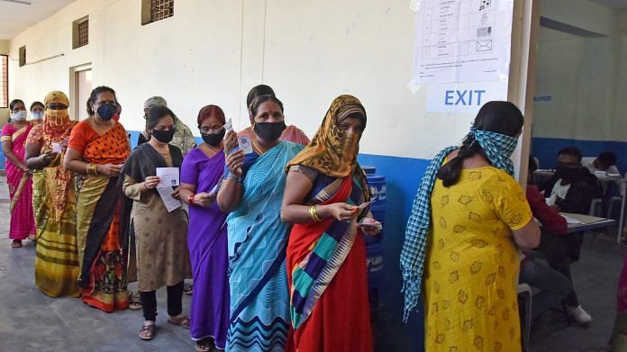 Voters standing in a queue at a polling booth during the GHMC Election, in Hyderabad on 1 December | ANI Photo