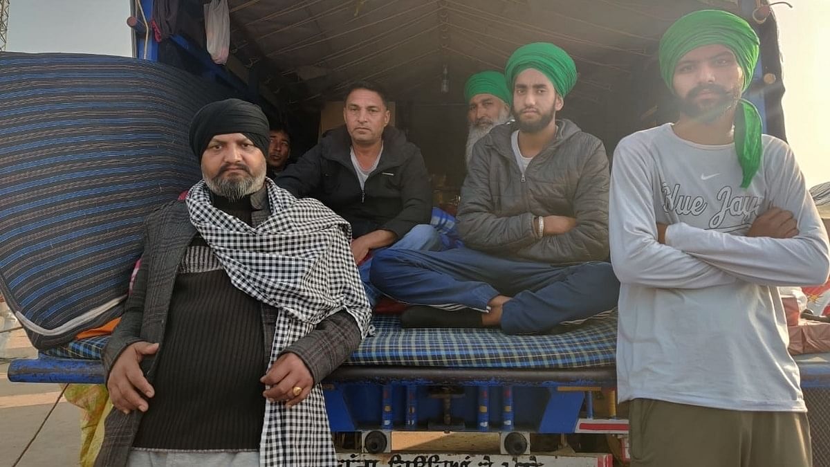 Chivranjan Singh (extreme left), protesting at the Singhu border, is confident his paralysed mother is being taken care of by neighbours back home. | Photo: Samyak Pandey/ThePrint
