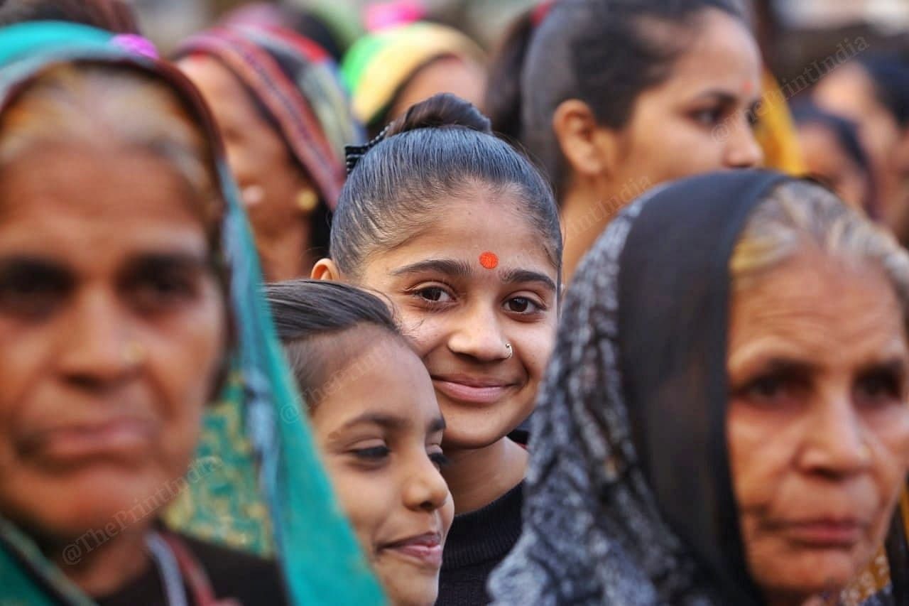 A girl smiles as the rally pass by | Photo: Praveen Jain | ThePrint