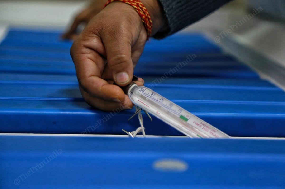 The temperature is checked by the health workers | Photo: Manisha Mondal | ThePrint