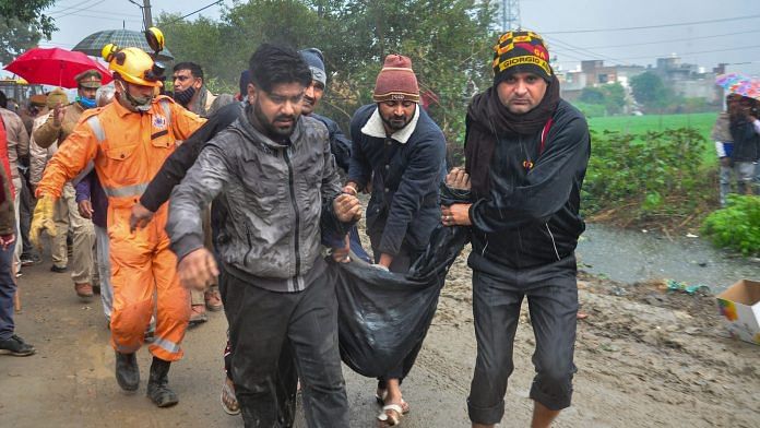 Rescue operation carried out by NDRF personnel after the complex roof of a crematorium collapsed due to heavy rain in Ghaziabad | PTI