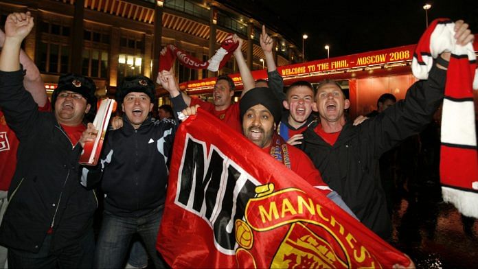 Manchester United supporters celebrate near the Luzhniki stadium after the soccer club defeated Chelsea | Photographer: Mikhail Galustov | Bloomberg News