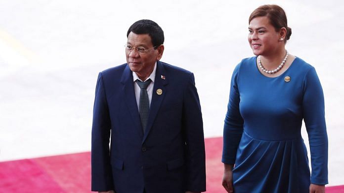 Philippines President Rodrigo Duterte (L) and his daughter Sara Duterte | Photo: AFP via Bloomberg