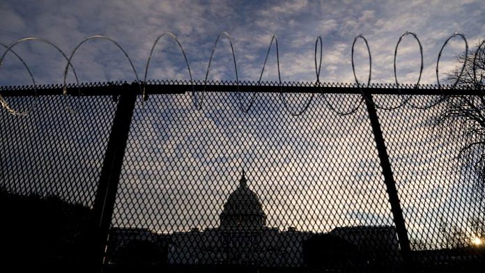 Temporary security fencing at the US Capitol in Washington, Tuesday, 19 January 2021, a day before Joe Biden is to be sworn in as President | Stefani Reynolds | Bloomberg