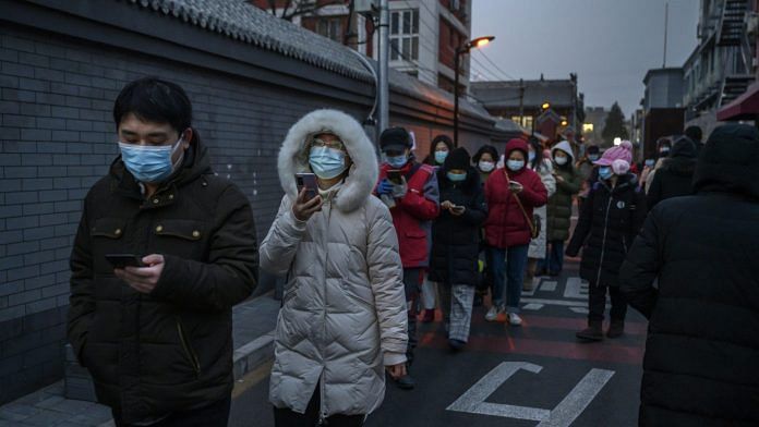 Residents of Dongcheng District in Beijing line up for Covid-19 testing on 22 January 2021 | Photographer: Kevin Frayer/Getty Images via Bloomberg