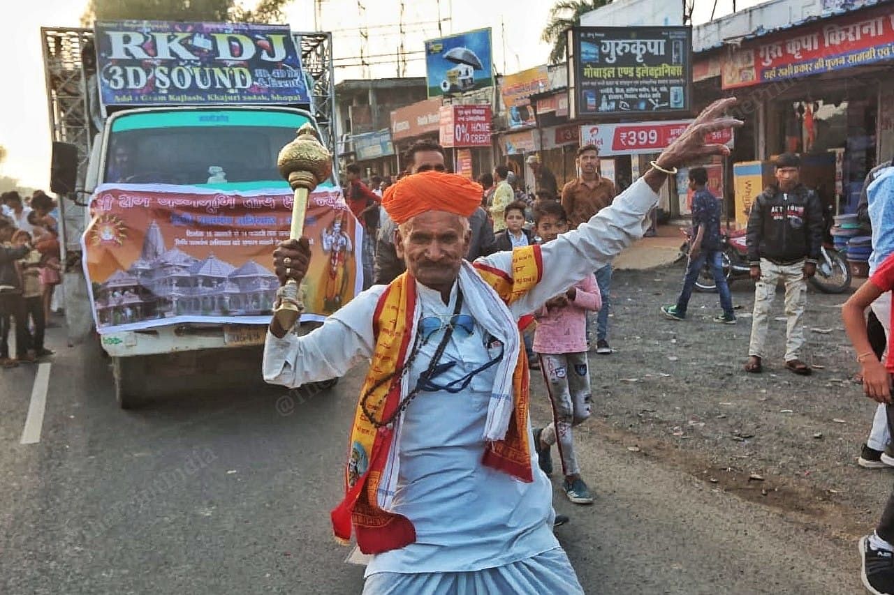 A man with a Hanuman gada dances in front of the crowd | Photo: Praveen Jain | ThePrint