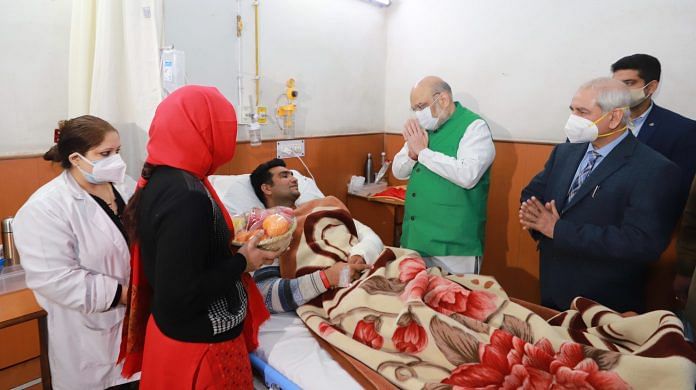 Home Minister Amit Shah meets an injured policeman in New Delhi on 28 January 2021 | Twitter: @AmitShah