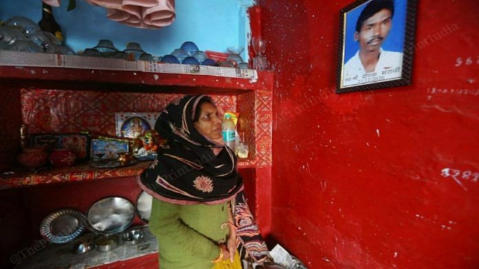 Vaijayanti Maravi looks at a photo of her husband Deepak Maravi, a trial participant who died last month | Praveen Jain | ThePrint