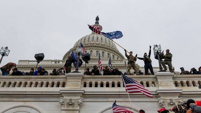 Demonstrators attempt to enter the US Capitol building during a protest in Washington, D.C., U.S., on 6 January 2021 | Eric Lee | Bloomberg