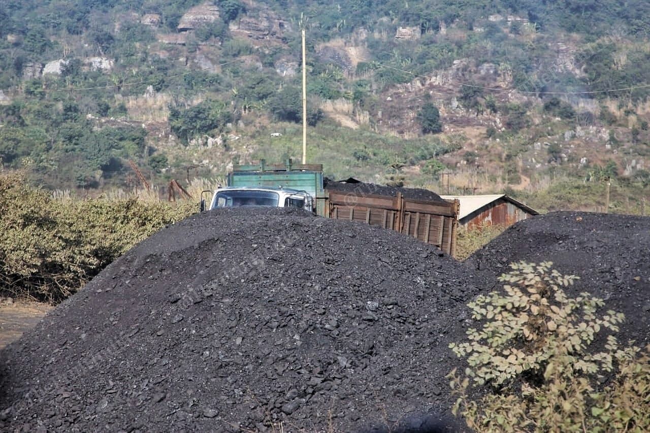 A truck parked by piles of coal extracted from a mine in East Jaintia Hills | Praveen Jain | ThePrint