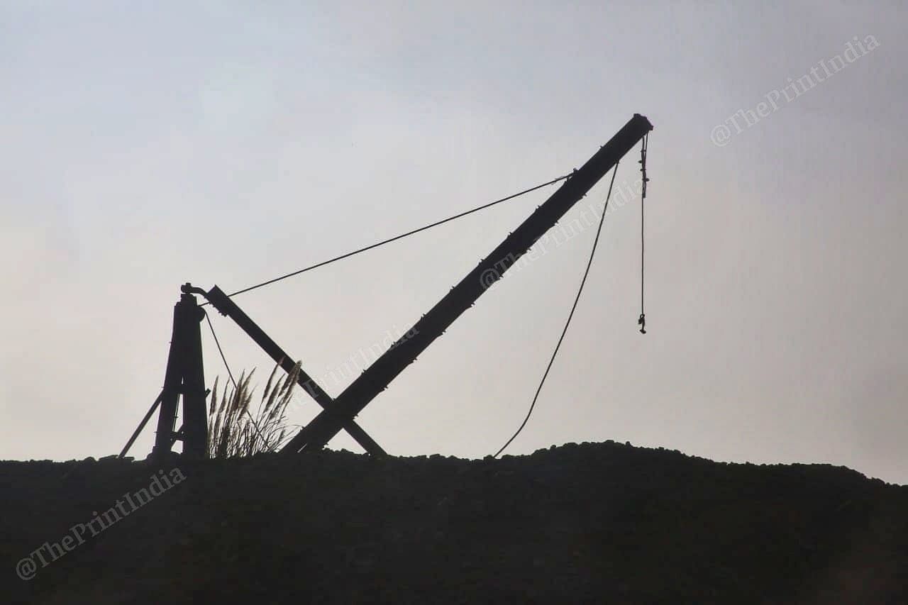 A crane is framed against the Meghalaya skies at an allegedly illegal mining site in East Jaintia Hills | Praveen Jain | ThePrint