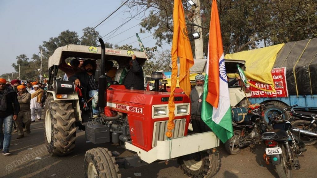 Farmers protesting at Singhu border prepare for the 26 January tractor rally, on Monday | Manisha Mondal | ThePrint