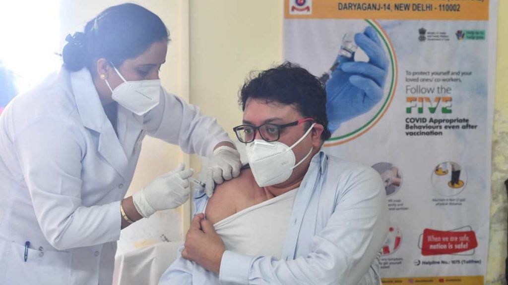 A health worker receives a Covid vaccine shot at  GB  Pant Hospital in New Delhi on 16 January 2021 | ThePrint photo