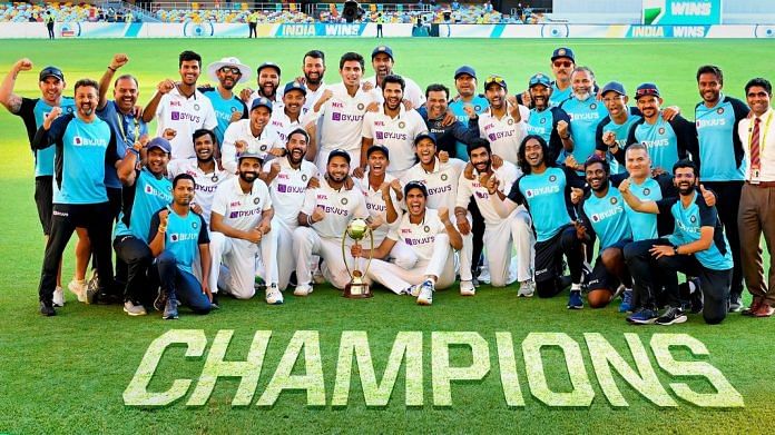 Indian players pose with the winning trophy after defeating Australia by three wickets on the final day of the fourth cricket test match at the Gabba, Brisbane, Australia | PTI Photo