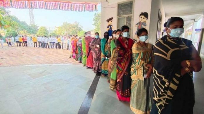 People stand in a queue to vote during the gram panchayat elections in Maharashtra's Ahmednagar district on 15 January 2021 | By special arrangement