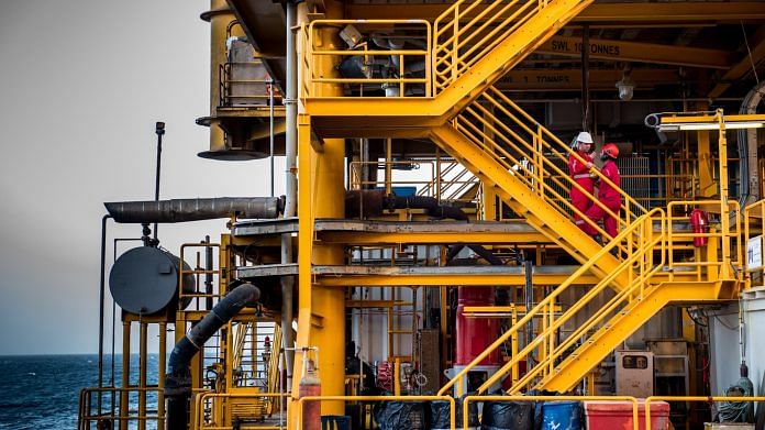 Workers aboard an offshore oil platform in the Persian Gulf's Salman Oil Field, near Lavan island, Iran | Photo by Bloomberg