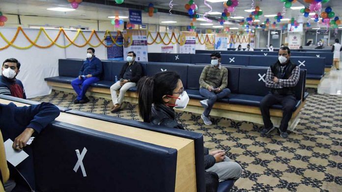 People maintain social distance while waiting for the Covid-19 vaccine at LNJP hospital, in New Delhi on 16 January 2020 | ANI