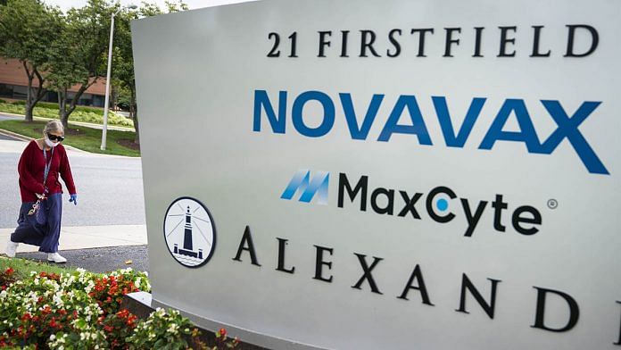 A pedestrians walks past signage displayed outside of the Novavax Inc. headquarters in Gaithersburg, Maryland, US on 8 August 2020 | Photo: Sarah Silbiger | Bloomberg