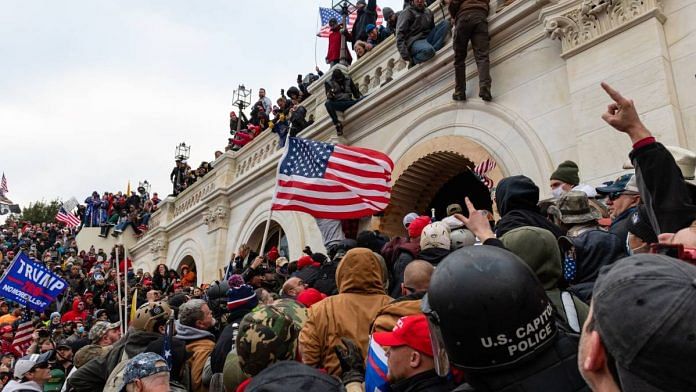 Demonstrators attempt to enter the US Capitol building during a protest in Washington, D.C., U.S., on 6 January 2021 | Eric Lee | Bloomberg