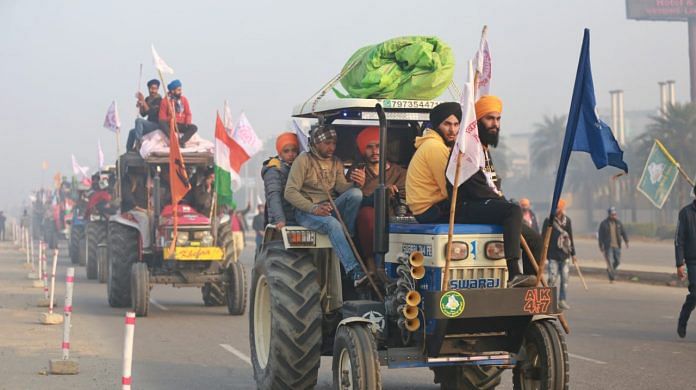 Famers during a tractor rally at Singhu border in New Delhi, on 26 January 2021