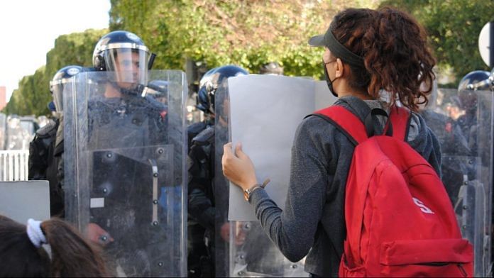 A protester facing the police on 23 January 2021 in Tunis, Tunisia | Photo: Shreya Parikh | ThePrint