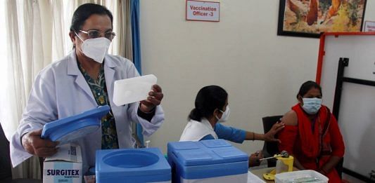 Health workers prepare for the dry run of COVID-19 vaccine at a community centre, in Gurugram, on 7 January 2021 | PTI Photo