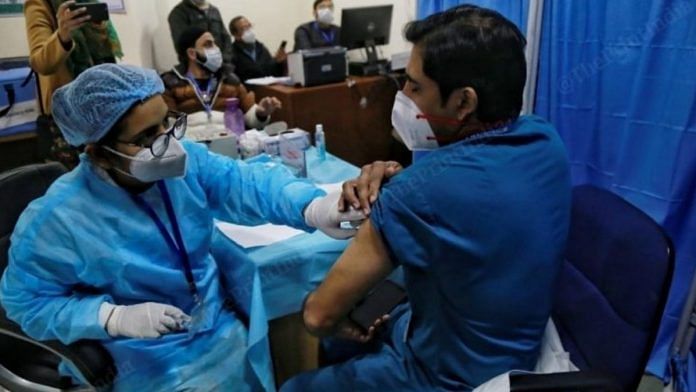 A health worker administering a Covid-19 vaccine shot | Manisha Mondal | ThePrint