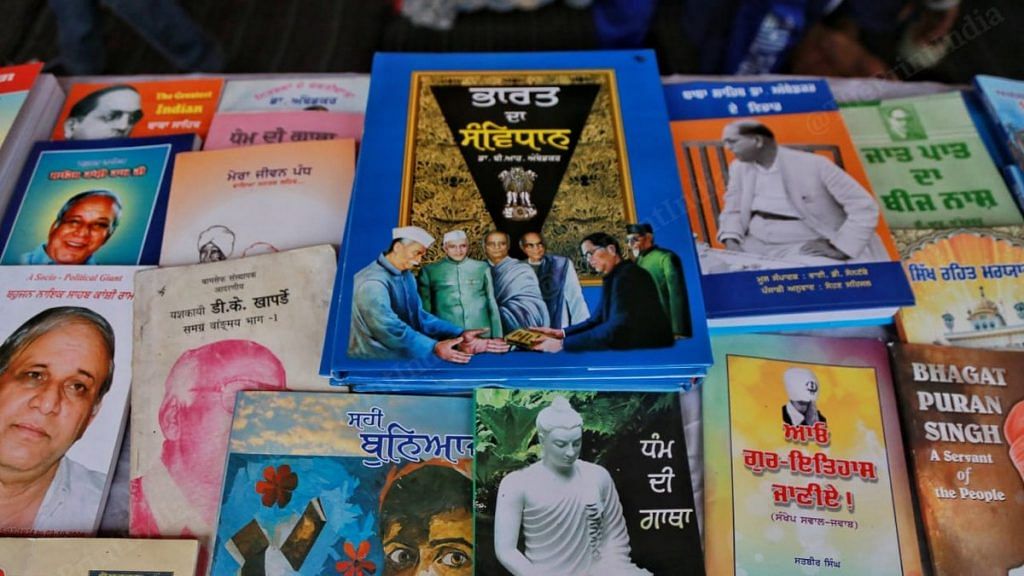 A selection of books available at the stall, including the Punjabi translation of the Constitution (top centre) | Photo: Manisha Mondal | ThePrint