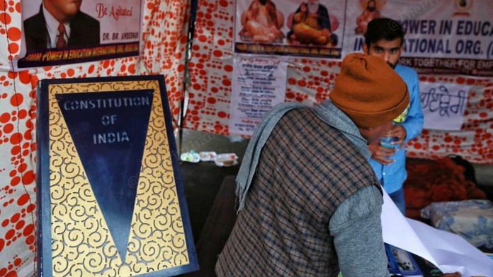 Copies of the Constitution of India are available for sale at a new book stall at the Singhu Border protest site outside Delhi | Photo: Manisha Mondal | ThePrint