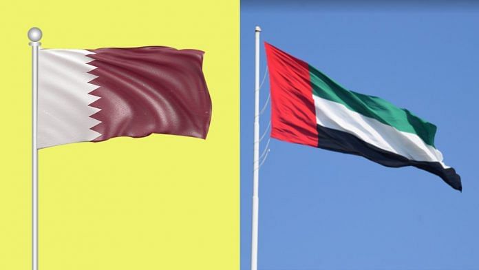 Flags of Qatar (L) and UAE