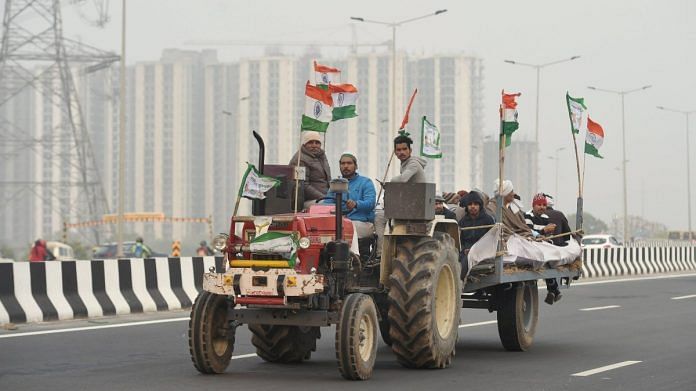 Representational image of a group of farmers riding a tractor on the outskirts of Delhi | PTI